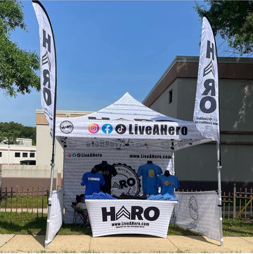 10' x 10' Pop-Up Tent with Full Wall, (2) Half Walls, Stretch-Fit Table Cover, (2) Double-Sided 8' Feather Flags with Tent Attachments - 0